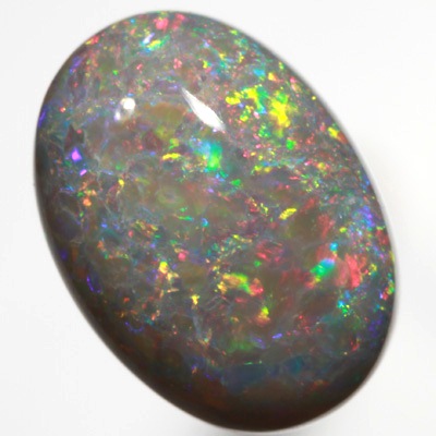 SOLID SEMI BLACK OPAL Bright red and green floats over a beautiful rare purple mauve SEE VIDEO